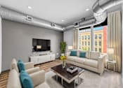 Thumbnail 3 of 8 - A modern living room with a white sofa, a coffee table, and a television.
