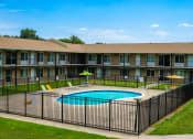 Thumbnail 6 of 14 - Swimming pool at Huntington Club Apartments in Warren, Michigan