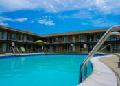 Thumbnail 7 of 14 - Swimming pool at Huntington Club Apartments in Warren, Michigan