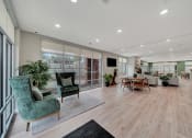 Thumbnail 1 of 48 - an open living room and dining area with a large window and a table and chairs