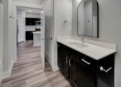 Thumbnail 26 of 48 - a bathroom with a sink and a mirror