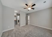 Thumbnail 24 of 48 - the living room is empty and has a ceiling fan
