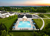 Thumbnail 21 of 44 - A large house with a pool in the backyard.