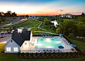 Thumbnail 18 of 44 - A large house with a pool in the backyard.