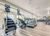 Thumbnail 10 of 15 - Gym with treadmills and other exercise equipment at ALARA Union Station Apartments, Denver, 80202