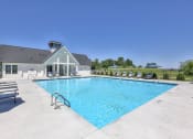 Thumbnail 4 of 14 - a swimming pool with a house in the background