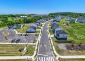 Thumbnail 2 of 14 - an aerial view of a neighborhood with cars parked on the street and houses