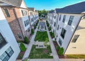 Thumbnail 13 of 23 - an aerial view of a courtyard in the middle of some buildings