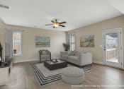 Thumbnail 10 of 51 - a living room with a couch and a coffee table