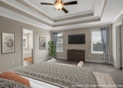 Thumbnail 25 of 51 - a bedroom with a large bed and a ceiling fan