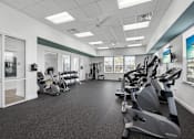 Thumbnail 12 of 47 - A spacious gym with a variety of exercise equipment.