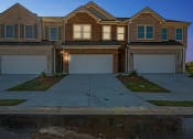 Thumbnail 45 of 50 - exterior night view of townhomes.