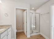 Thumbnail 32 of 50 - primary bathroom with stand up shower and water closet.