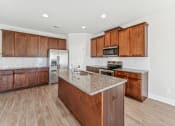 Thumbnail 25 of 50 - Kitchen with espresso colored cabinets, island and large pantry.