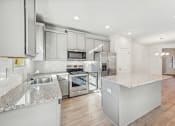 Thumbnail 14 of 50 - Kitchen view with island and stainless steel appliances