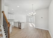 Thumbnail 43 of 50 - dining area next to kitchen island with white cabinet color scheme.