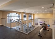 Thumbnail 28 of 38 - Row machine located on 2nd floor fitness center at The Bartram Apartments in Gainesville, FL 32608