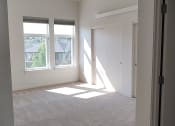 Thumbnail 11 of 30 - a bedroom with two windows and a door