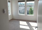 Thumbnail 9 of 30 - an empty room with three windows