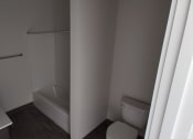 Thumbnail 12 of 30 - a bathroom with a toilet sink and bathtub