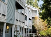 Thumbnail 3 of 16 - Private patios with every unit at Wingsong Manor Apartments, Portland, OR