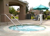 Thumbnail 26 of 29 - a jacuzzi in the pool of a house with an umbrella