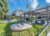 Thumbnail 13 of 30 - A park with a picnic table and a pavilion.