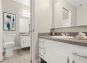 Thumbnail 6 of 15 - a bathroom with a sink and a toilet