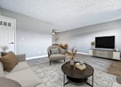 Thumbnail 6 of 15 - a living room with white walls and a large flat screen tv