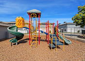 Thumbnail 27 of 35 - a playground with a slide and climbing equipment