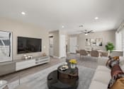 Thumbnail 2 of 29 - A modern living room with a television, sofas, and a coffee table.