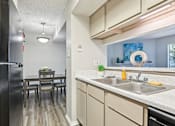 Thumbnail 59 of 110 - Model Kitchen at Abbey Glenn Apartments, Waco, Texas