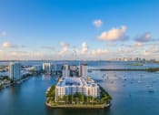 Thumbnail 1 of 28 - an aerial view of a body of water with buildings and boats