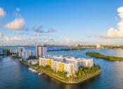 Thumbnail 2 of 28 - an aerial view of a body of water with buildings and a harbor