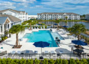 Thumbnail 29 of 92 - an aerial view of a swimming pool with umbrellas at the resort atrium