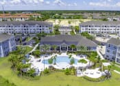 Thumbnail 28 of 29 - an aerial view of a resort with a large swimming pool