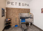 Thumbnail 17 of 31 - a spa with a sink and a bath tub in a room with a sign above