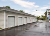 Thumbnail 27 of 29 - a row of garage doors on the side of a building