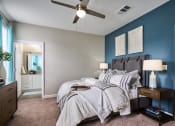 Thumbnail 3 of 29 - a bedroom with a large bed and a ceiling fan