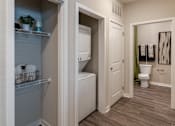 Thumbnail 5 of 31 - a bathroom with a closet and a toilet and a sink