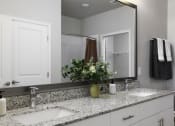 Thumbnail 8 of 29 - a bathroom with two sinks and a mirror