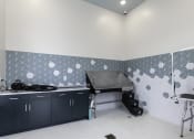 Thumbnail 25 of 29 - a kitchen with a stove and a sink