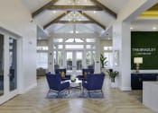 Thumbnail 15 of 29 - the bradley living room with blue chairs and a table