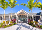 Thumbnail 18 of 54 - a house with palm trees in front of it