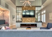 Thumbnail 34 of 54 - a living room with a fireplace and a tv