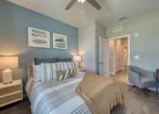 Thumbnail 54 of 54 - a bedroom with a large bed and a ceiling fan