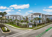 Thumbnail 29 of 29 - an empty street in front of a large building with palm trees