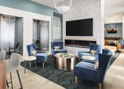 Thumbnail 15 of 30 - a living room with blue chairs and a table with a laptop