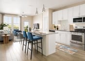 Thumbnail 2 of 30 - an open kitchen and living room with an island with blue chairs