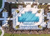 Thumbnail 29 of 62 - An aerial view of a house with a swimming pool in the backyard.